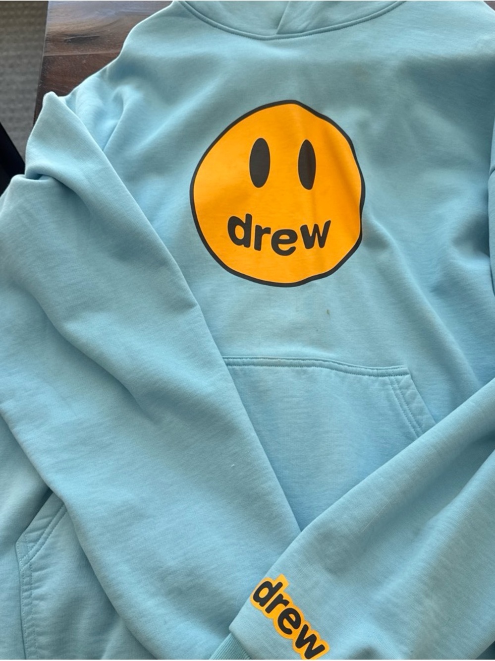 drew house sky blue hoodie with yellow logo tag